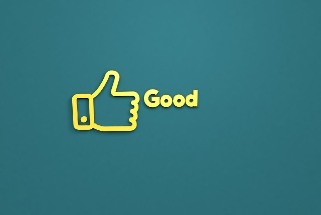 Goodの文字とサムズアップをしている手のイラスト画像