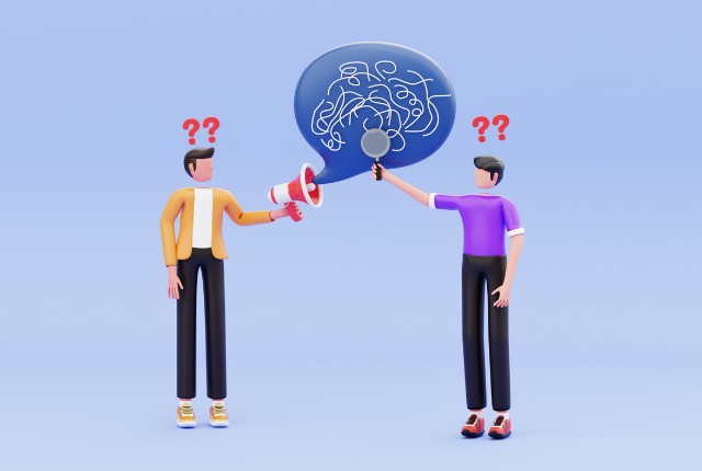 会話がかみ合わず困惑する2人の男性。特定技能外国人と企業の意思疎通の課題を表すイメージ